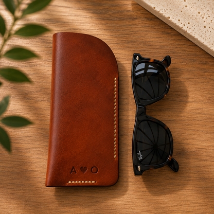 Brown leather glasses holder with hand stitching